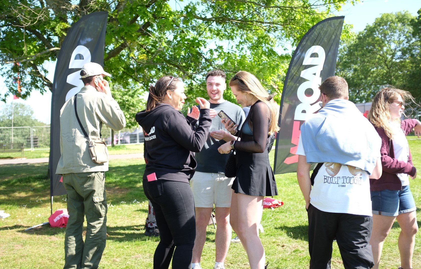 Group of people enjoying talking to a Brand Ambassador at a festival in Brockwell Park, London